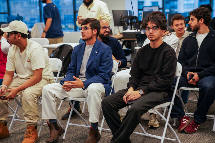 People sitting and listening as a speaker gives a talk