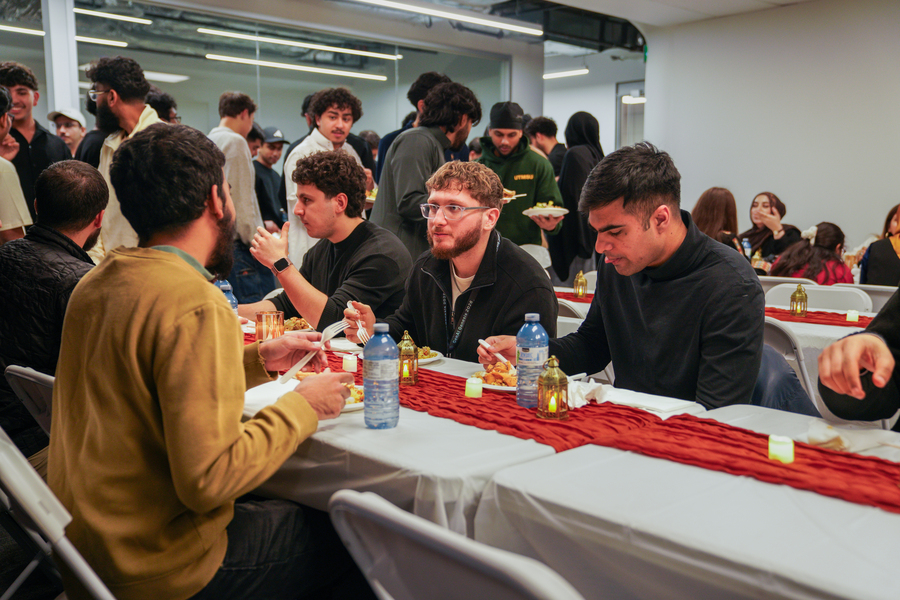 People sitting and eating together to break their fast